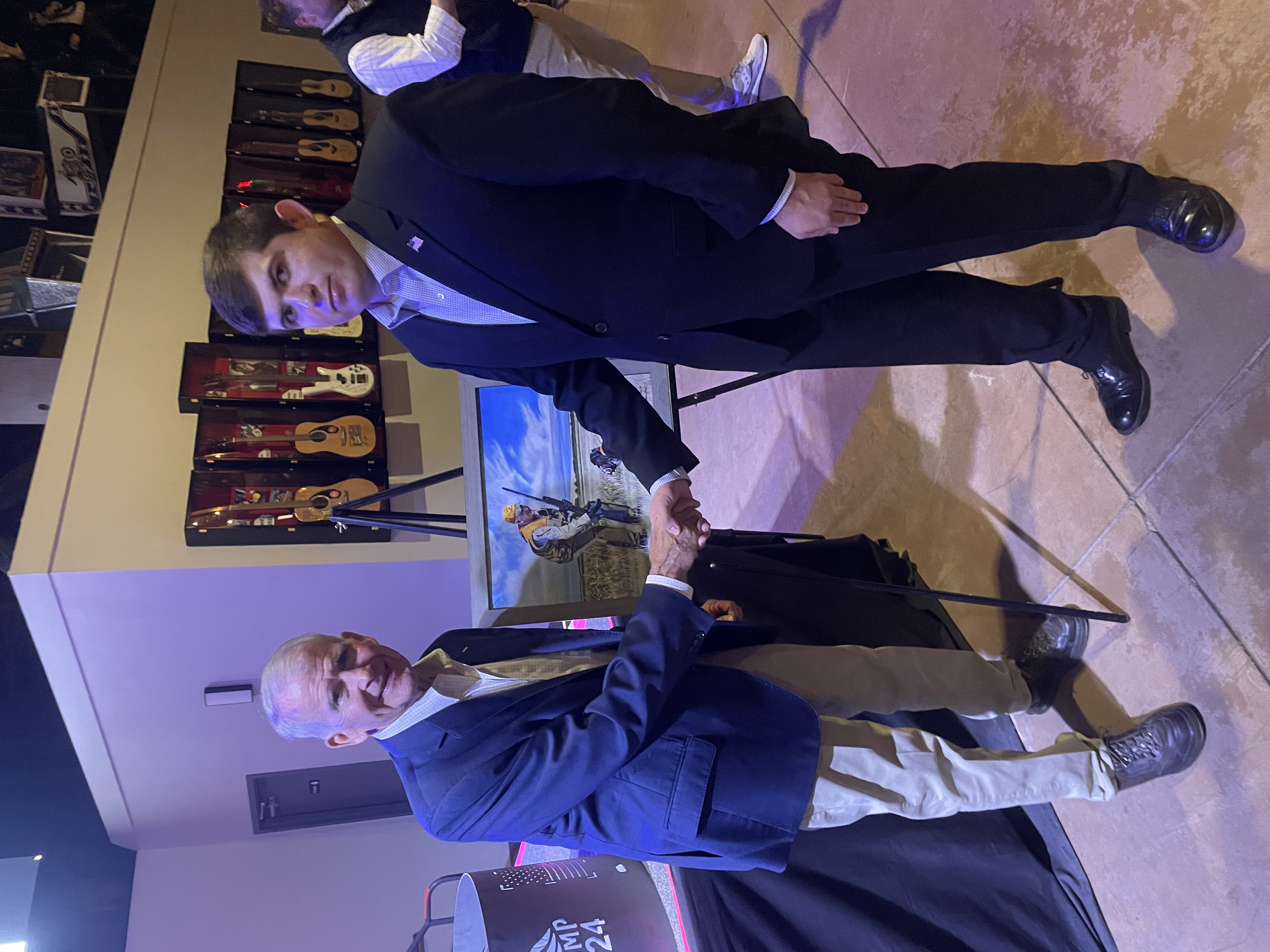 Lucas Cook shaking hands at a public event